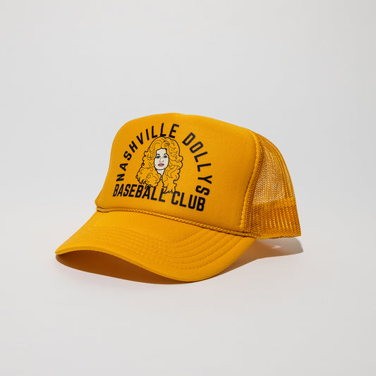 Yellow Nashville Dollys Baseball Club retro trucker hat with illustration of Dolly Parton, angled side view.