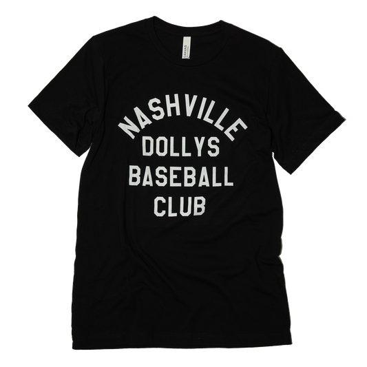 Flat lay of a black t-shirt featuring bold white text reading 'Nashville Dollys Baseball Club,' neatly arranged on a white background.