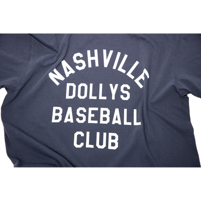 "Close-up of white block text Nashville Dollys Baseball Club' on navy fabric.